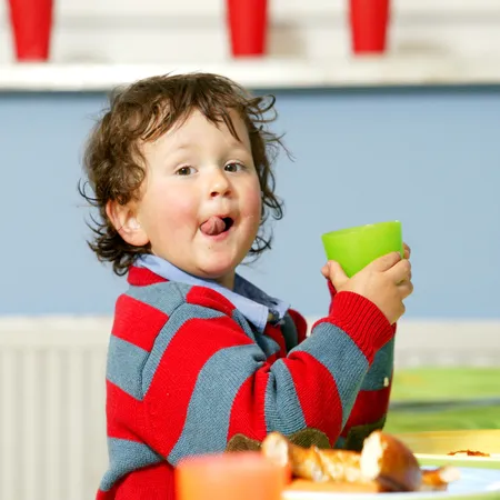 Child at the dining table at the Alphotel Kid's Club